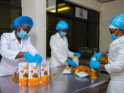 Burton and Bumber staff packaging processed dried mangoes chips at their factory