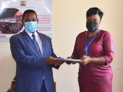 Makueni County Government CEC for Agriculture, Irrigation, Livestock and Fisheries Development Hon. Nzioki King'ola and MESPT CEO Mrs. Rebecca Amukhoye exchanging the signed GEAP MoU.